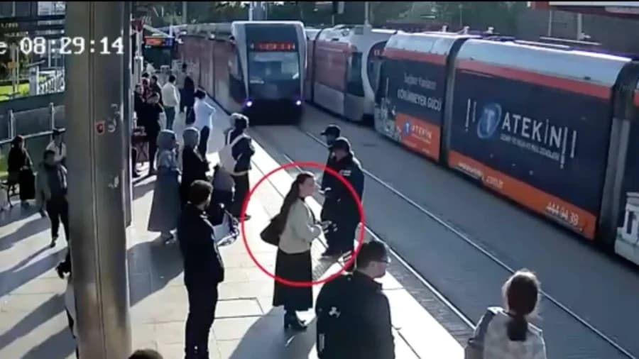 Security Guard Saves Woman From Oncoming Tram