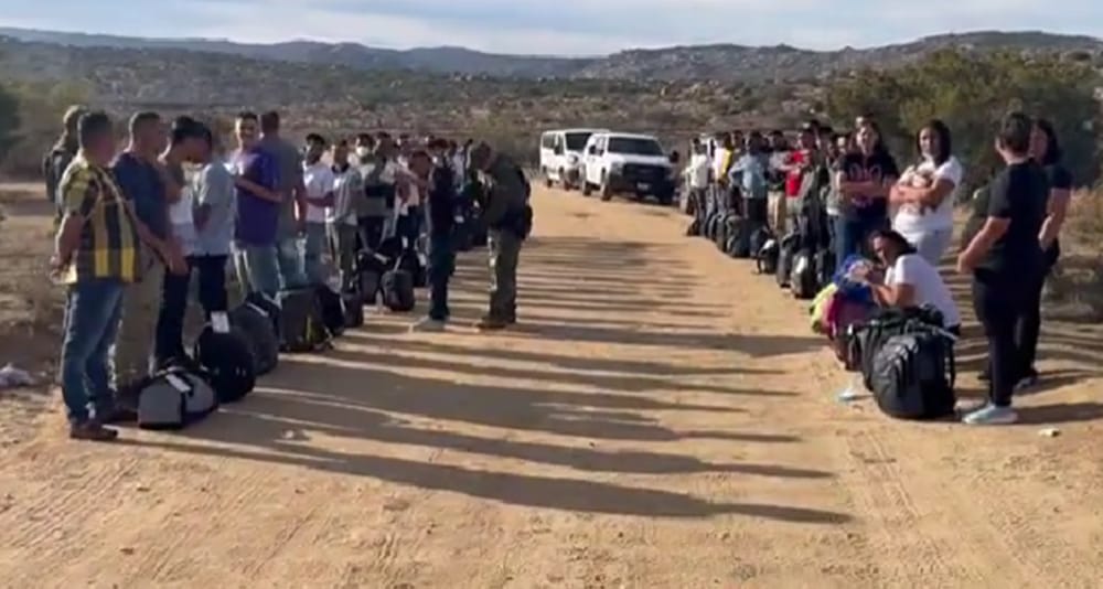 Video posted to social media appears to show a large group of Chinese illegal immigrants crossing the southern border from Mexico into California.