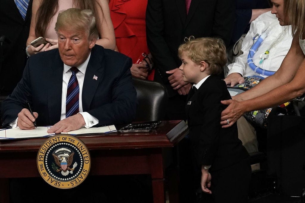 Trump hugs child
