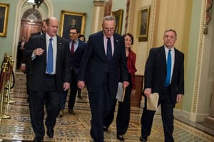 chris coons far left