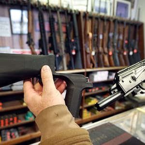 SALT LAKE CITY, UT - OCTOBER 5: A bump stock device, (left) that fits on a semi-automatic rifle to increase the firing speed, making it similar to a fully automatic rifle, is shown next to a AK-47 semi-automatic rifle, (right) at a gun store on October 5, 2017 in Salt Lake City, Utah. Congress is talking about banning this device after it was reported to of been used in the Las Vegas shootings on October 1, 2017. (Photo by George Frey/Getty Images)