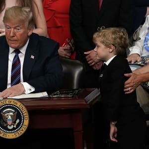 Trump hugs child
