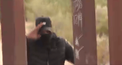 Shocking video captured in Arizona shows numerous illegal immigrants running through a hole in the border wall, aided by a human smuggler, in full view of border patrol agents.
