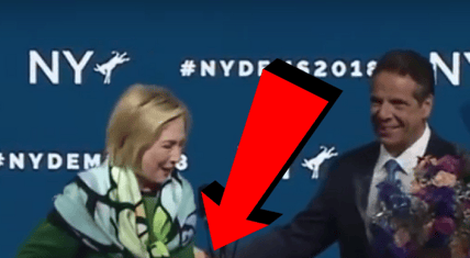 andrew cuomo helps hillary clinton up single step