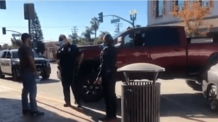 A video taken in early December shows a "desperate" restaurant owner confronting a health inspector over COVID restrictions, blocking his vehicle in with a truck.