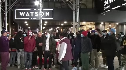 A group of illegal immigrants who have been housed in free New York City hotel rooms is reportedly refusing to relocate to a new "mega-shelter" in Brooklyn and instead sleeping in the street as a means of protest.