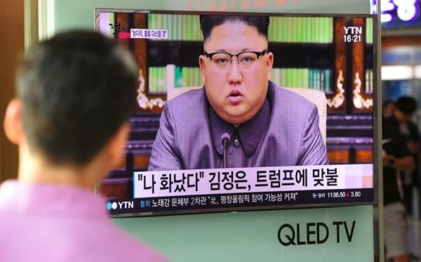 north korea threaten japan A man watches a television news screen showing a picture of North Korean leader Kim Jong-Un delivering a statement in Pyongyang, at a railway station in Seoul on September 22, 2017. US President Donald Trump is "mentally deranged" and will "pay dearly" for his threat to destroy North Korea, Kim Jong-Un said on September 22, as his foreign minister hinted the regime may explode a hydrogen bomb over the Pacific Ocean. / AFP PHOTO / JUNG Yeon-Je (Photo credit should read JUNG YEON-JE/AFP/Getty Images)