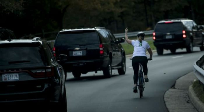woman flips off trump