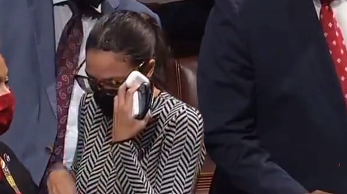 Representative Alexandria Ocasio-Cortez (AOC) had to be consoled as it appears she was crying after voting 'present' on a measure to replenish $1 billion in funding for Israel’s Iron Dome missile defense system.