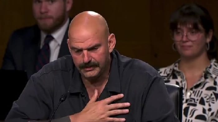 Senator John Fetterman fought through tears while discussing being bullied during a committee hearing Thursday.