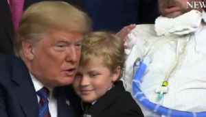 Trump hugs child