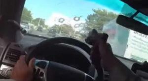 cop shoots through windshield