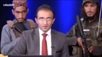 Afghan TV Host Tells Public Not To Be Afraid And Cooperate While Surrounded By Taliban With Guns