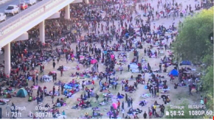 Drone footage has emerged showing thousands of migrants camped out under a bridge in Del Rio, Texas, as reports indicate the Biden administration is overseeing the worst August at the border in 21 years.
