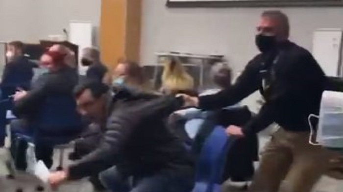 A father attending a school board meeting in upstate New York was physically removed from the room by security after declining to wear a mask, just days after board members were photographed maskless at an indoor event.