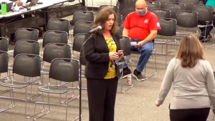 A pro-mask chairwoman for the Montgomery County School Board stormed out of a public meeting after a parent showed images of her failing to wear a mask in public.