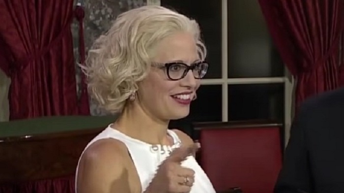 Senator Kyrsten Sinema is playing coy on whether or not she'll support the Democrats' so-called 'Inflation Reduction Act' - a thinly veiled tax hike and climate change bill - saying she is "taking my time."