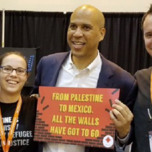 Senator Cory Booker, who was just forced to flee the Hamas terrorist attacks against Israel this past weekend, was seen in 2018 holding up a sign in support of pro-Palestine activists.