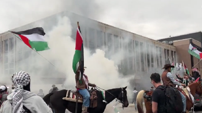 Smoke Bombs Fill The Air As Thousands Of Pro-Palestinian Protesters Take To The Streets In Austin, Texas