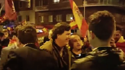 X media personality Tucker Carlson marched with anti-amnesty protesters in Spain earning him praise from those on the streets and online commentary suggesting he is essentially a world leader now.
