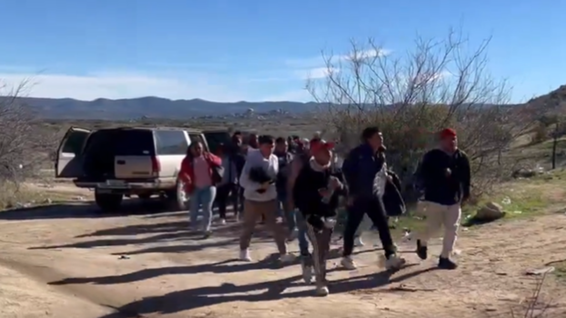 Two human smuggling SUVs were filmed dropping off groups of illegal immigrants near the US border.